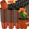 A stack of terracotta-colored plastic nursery pots, some with orange plant shoots visible.