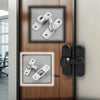 Close-up of a wooden door featuring two styles of adjustable sliding pin locks, one silver and one black.