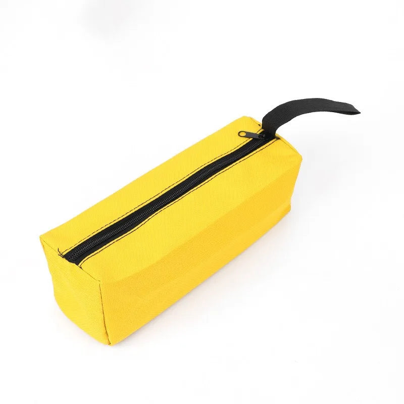 A bright yellow Oxford cloth hand-held storage bag with a black zipper and strap.