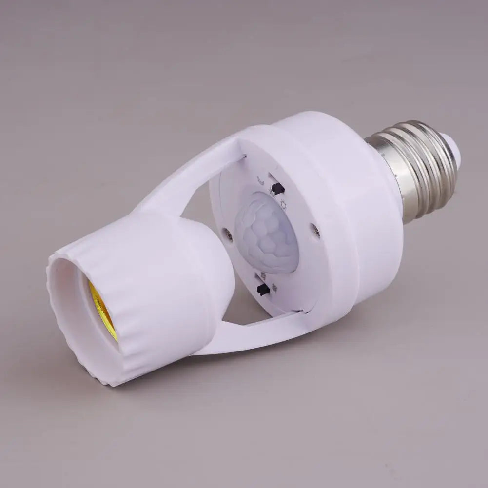 A white PIR motion sensor light bulb adapter with a silver threaded connector and a translucent lens.