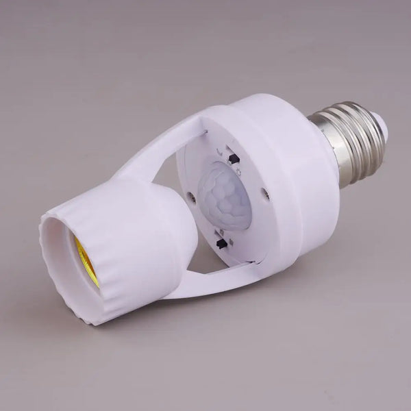A white PIR motion sensor light bulb adapter with a silver threaded connector and a translucent lens.