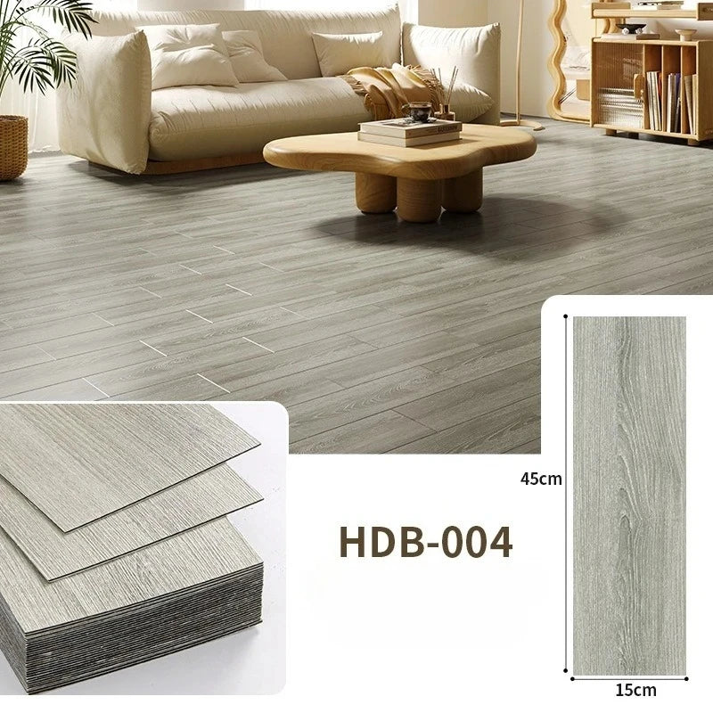 Close-up view of light gray wood grain floor tiles and a sample strip showing the texture.