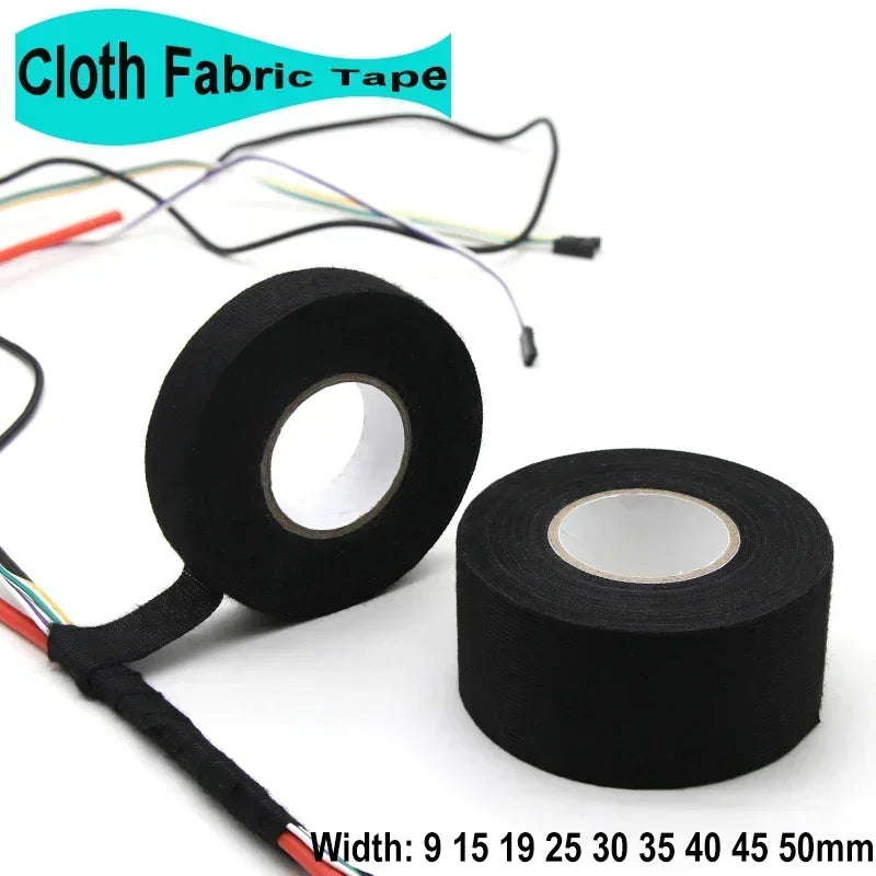 Rolls of black cloth fabric tape with various colored wires attached for electrical insulation and repair