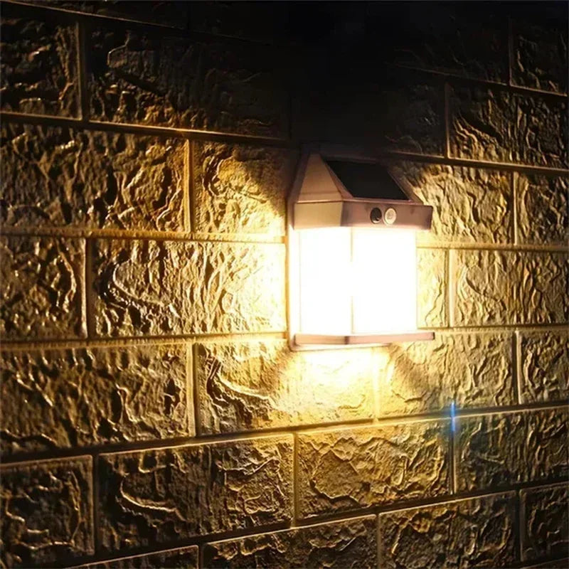 A modern outdoor wall light fixture mounted on a textured stone or tile wall.