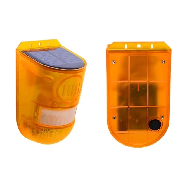 An orange solar motion security alarm device with a solar panel on top.