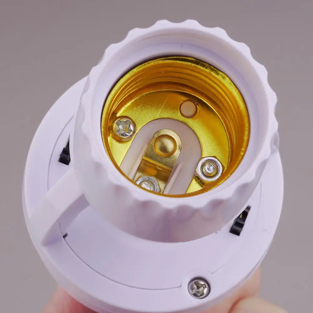 A white adapter for a PIR motion sensor light bulb, showing the golden socket and plastic housing.