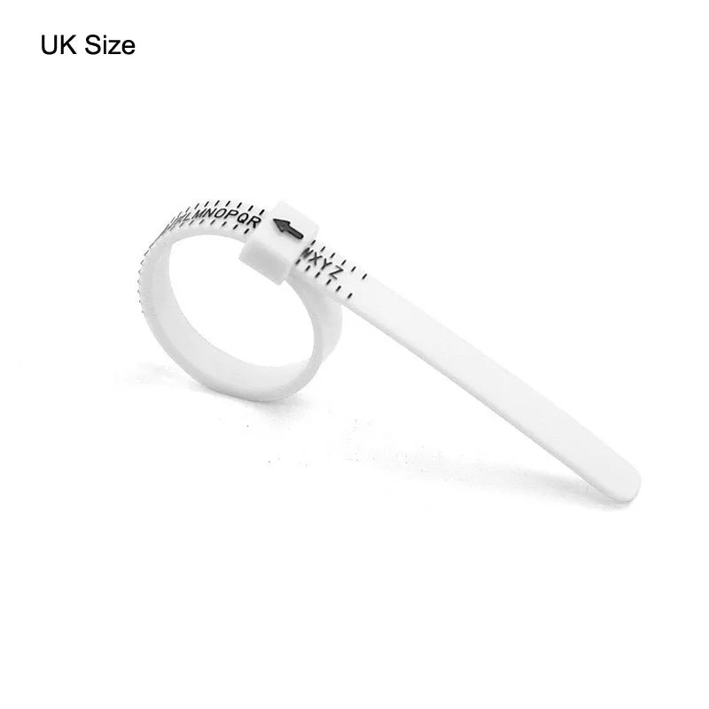 A white precision plastic ring sizer with a flexible band and a measurement tool.