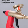 A close-up view of a professional PU foam sealant spray gun with a gold handle and red grip.
