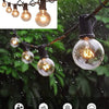 Black Q-hanger screw hooks for outdoor decor with multiple light bulbs hanging in a rainy environment