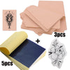A set of professional tattoo practice skin and transfer kits including pink sheets, a yellow roll, and a white floral design.