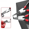 A pair of silver and red precision multifuntional pliers used for retaining rings and shafts.