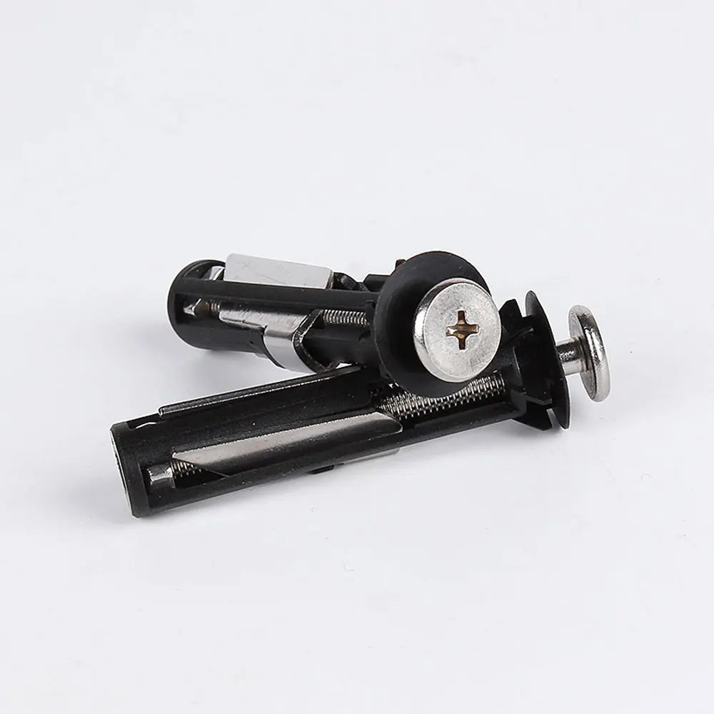 A close-up view of stainless steel toilet seat hinge bolts and mounting hardware.