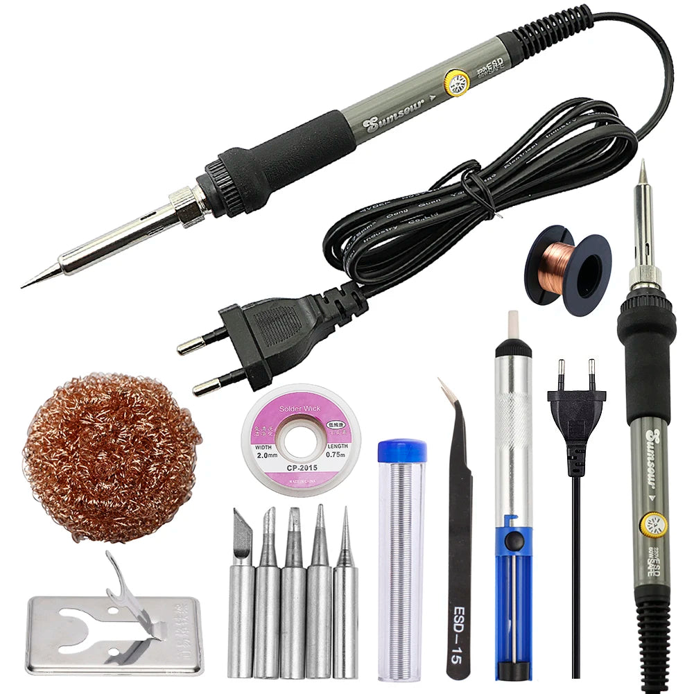 A set of precision digital soldering irons and related tools including tips, solder wire, and a cleaning tool.