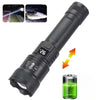 A black high-power tactical LED flashlight with a green light beam and an accompanying liquid solution.