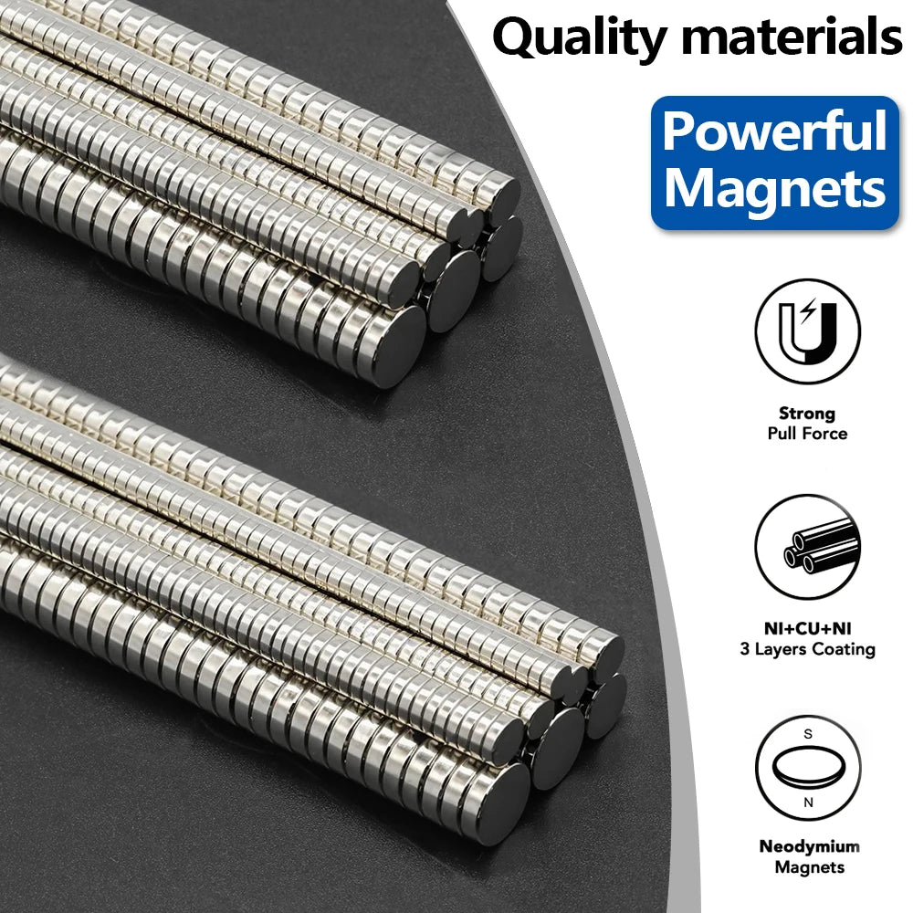 Close-up view of silver and black neodymium fridge magnets showing various magnetic features and layers