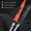 A close-up view of a red JCD 908S electronic soldering iron with a gold tip resting on a black surface.