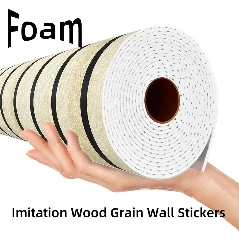 A hand holds a roll of imitation wood grain wall stickers, showing the texture and white wrapping.