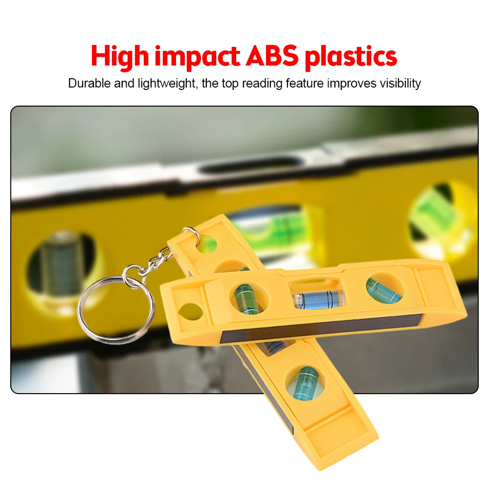 Yellow high impact ABS plastic mini bubble level with a keychain for precision measurement