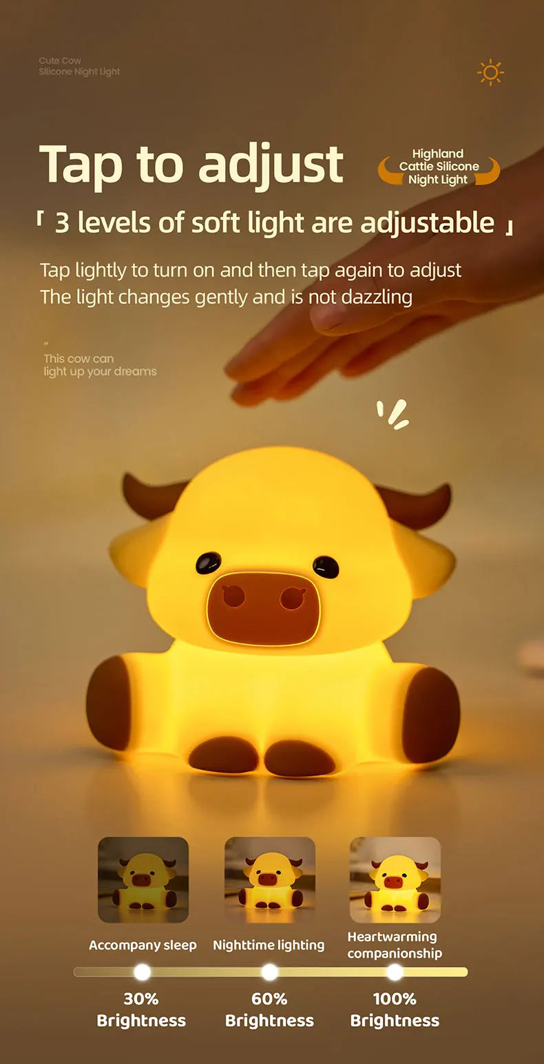 A yellow Highland cattle night light lamp illuminating a cow figure with adjustable brightness levels.