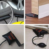 A black flexible air pump wedge used to seal gaps in door windows.