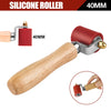 A wooden handle silicone roller tool with a red roller and brass fitting, shown in various views.