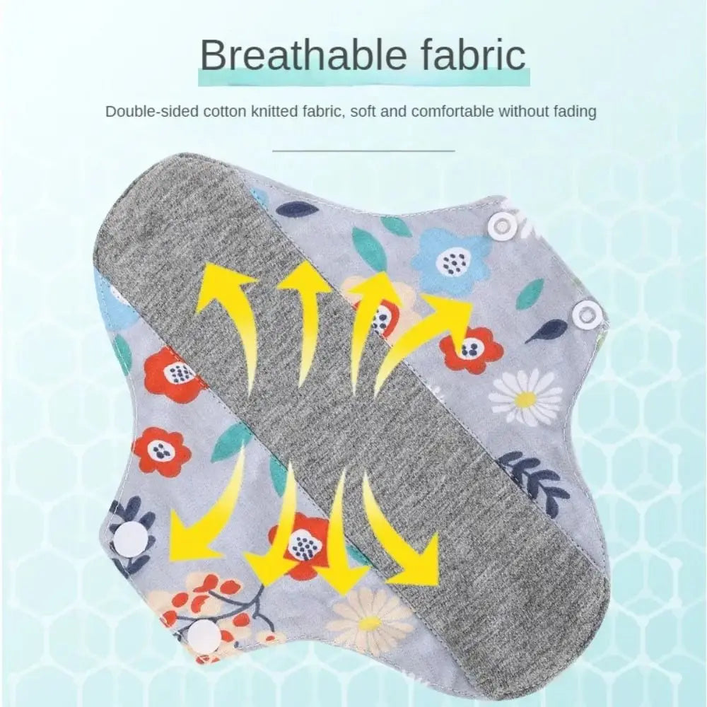 Gray and floral reusable absorbent sanitary cloth pads shown with arrows indicating breathability