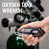 A hand holds an oxygen tank wrench tool used for maintenance or emergency purposes.