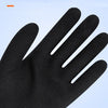 Close-up of a black palm-coated foam latex winter glove being held, showing its grip performance.