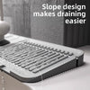 A silicone sink drain mat with a slope design is shown on a white surface.