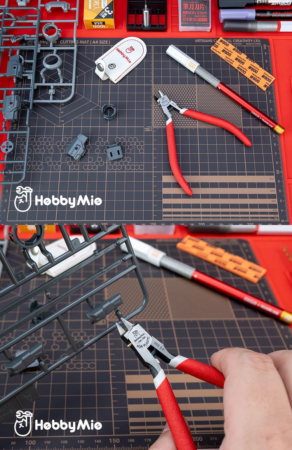 Precision hobby nippers and tools laid out on a dark cutting mat for model building