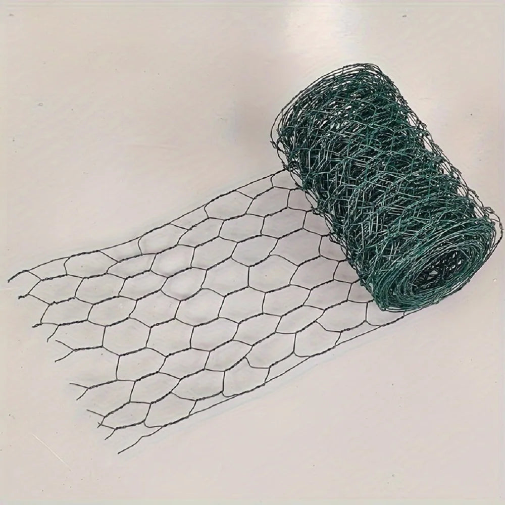 A coil of green chicken wire mesh laid out next to a flat piece of the same material.