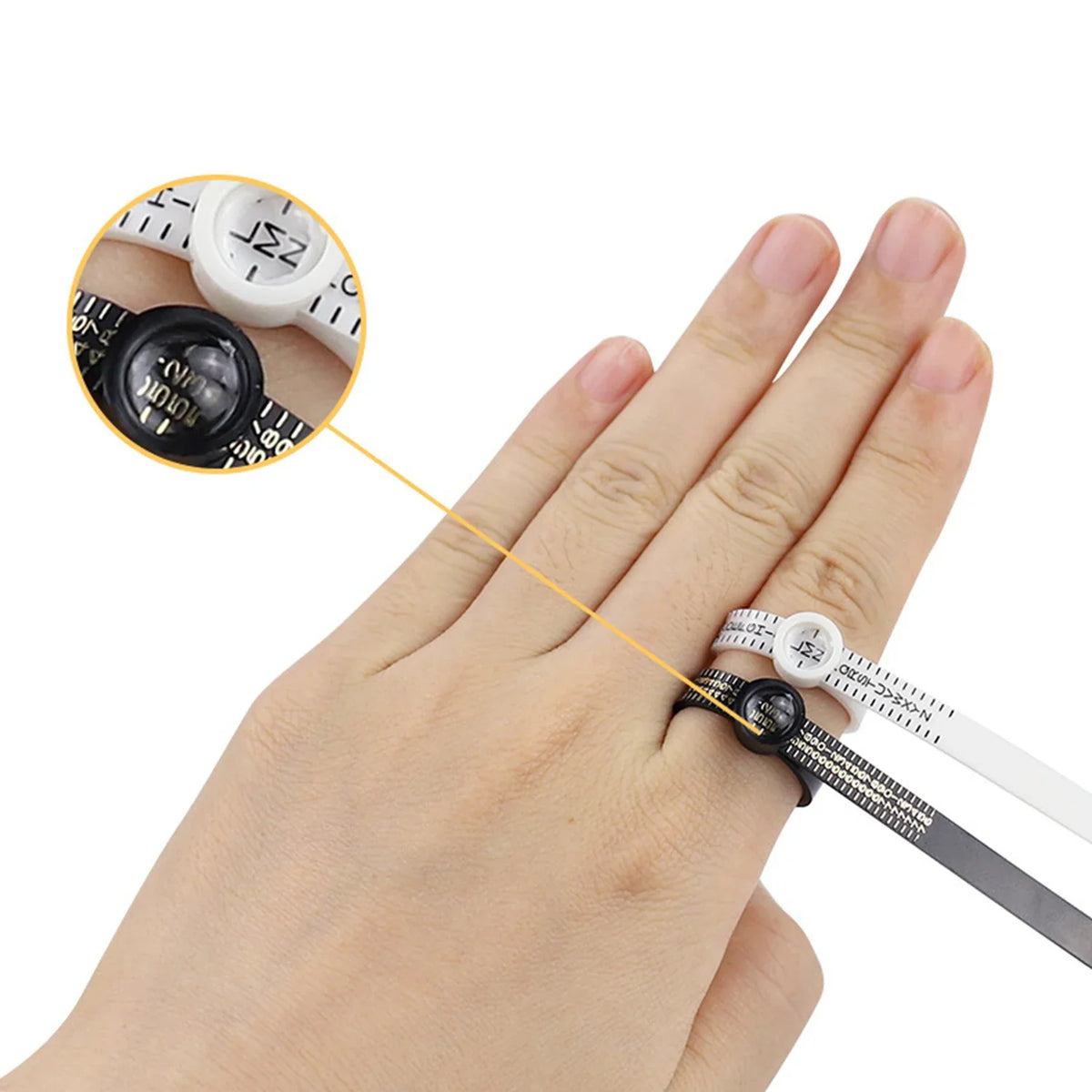 A hand wearing a precision ring sizer and magnifier tool for measuring rings.