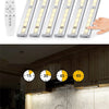 Wireless under cabinet LED light bar with remote control shown next to multiple light bars and a control device.