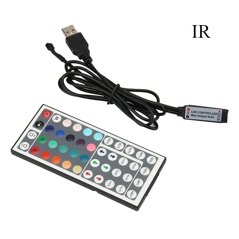 A multi-function RGB LED strip controller with a keypad and power cord.