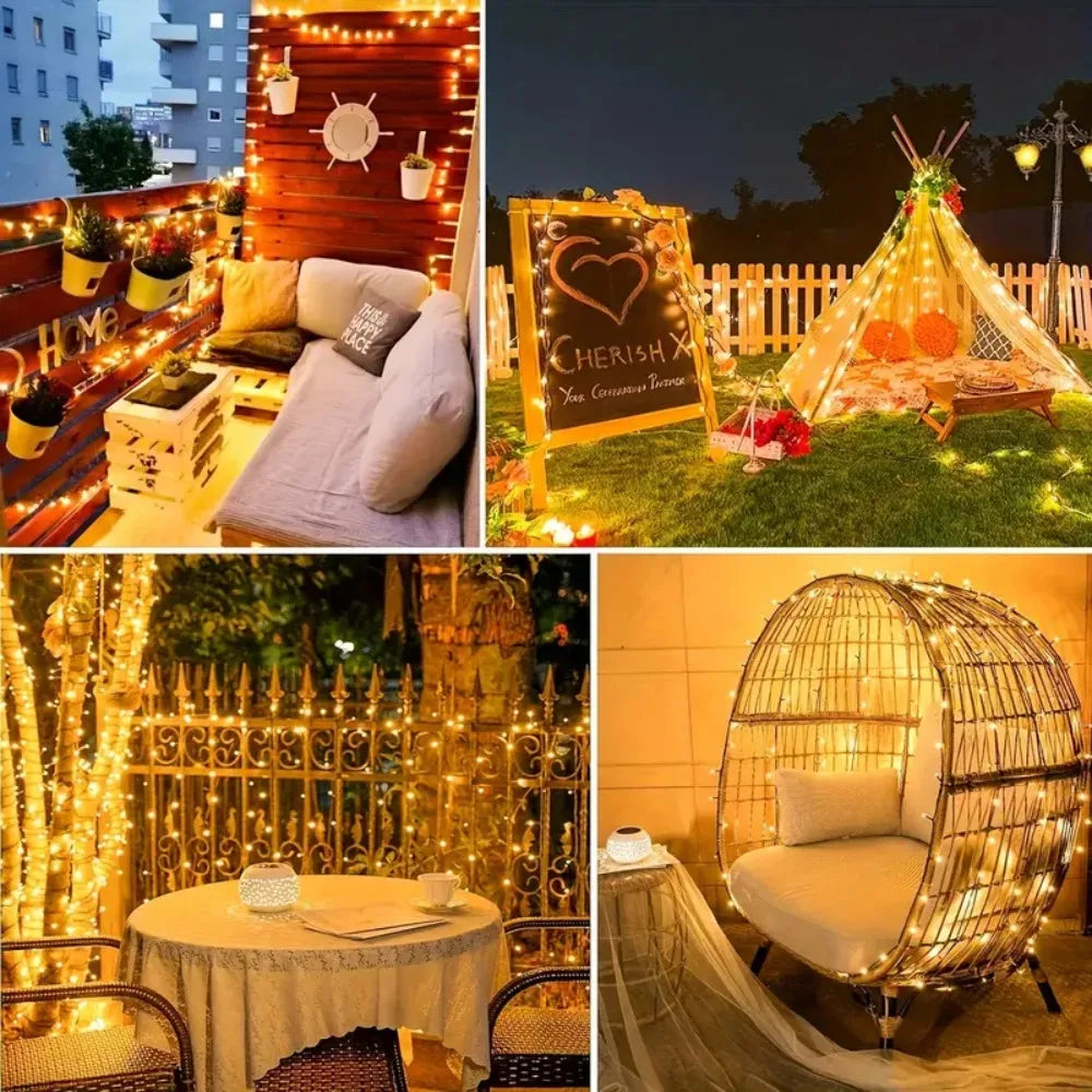 A golden pyramid tent decorated with string lights and orange flowers in an outdoor garden setting.