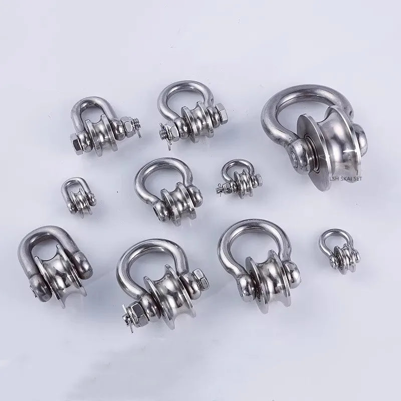 A set of heavy-duty stainless steel buckle pulleys and hardware components.