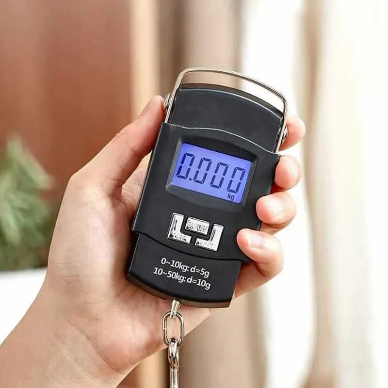 A hand holds a black portable digital luggage scale with a precision hook, displaying a weight of 0.000 kg.