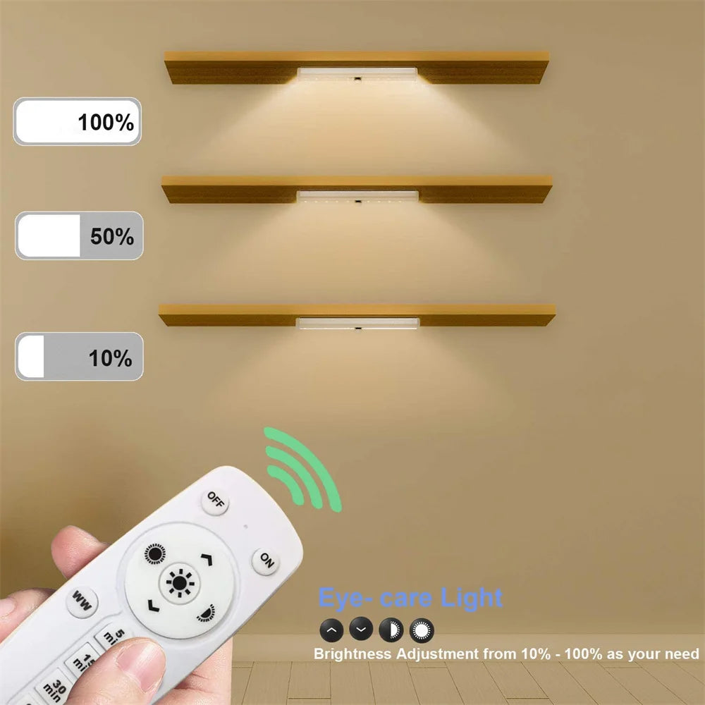 Wireless under cabinet LED light fixture with remote control demonstrating brightness adjustment levels
