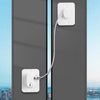A white universal door and window safety lock installed on a gray door frame.