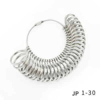 A coiled precision metal ring sizer kit with multiple rings visible.