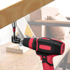A red and black impact socket adapter set tool is shown with a wooden surface in the background.