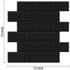 A rectangular arrangement of black self-adhesive subway wall tiles.