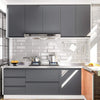 Modern kitchen featuring gray cabinetry, stainless steel appliances, and subway tile backsplash.
