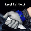 A hand wearing Level 9 anti-cut safety gloves holding a knife.