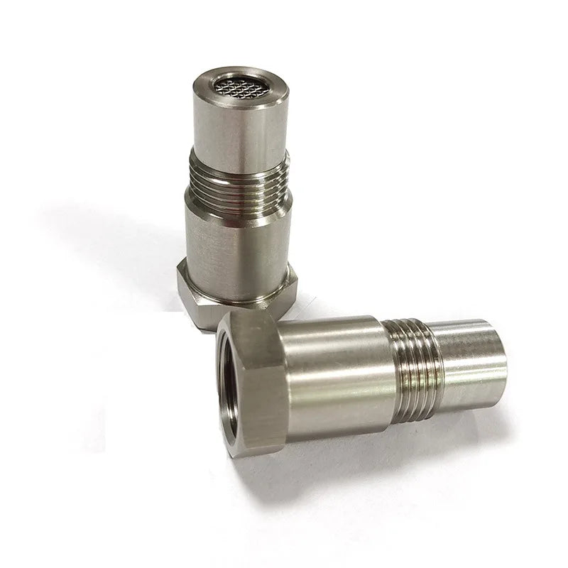 A metallic precision oxygen sensor adapter with threaded connections and a cylindrical body.