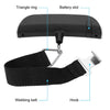A black portable digital luggage scale with a triangle ring, battery slot, and webbing belt hook.