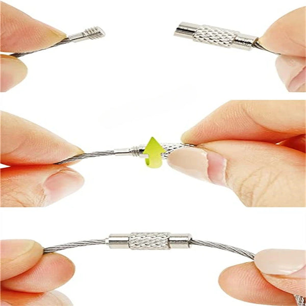 A set of stainless steel wire keychain tags, showing various wire shapes and a yellow tag being held by fingers.