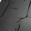 A close-up view of 50 aluminum metal stamping tags for crafts and keychains in black.