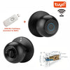 A black biometric fingerprint smart door lock with a white USB BLE gateway and a brass key.