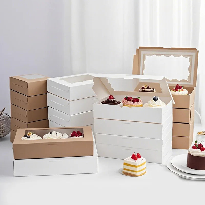 A set of stacked white and brown decorative gift boxes for parties and events, including tiered and rectangular shapes.